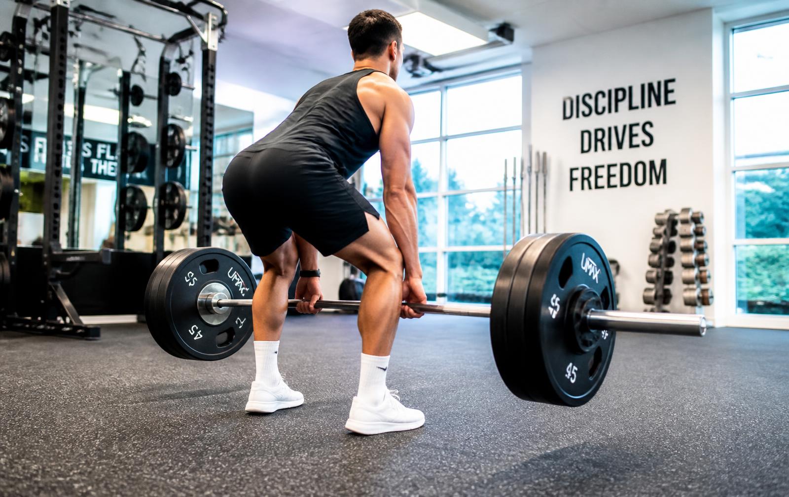 Athlete lifting a heavy loaded barbell